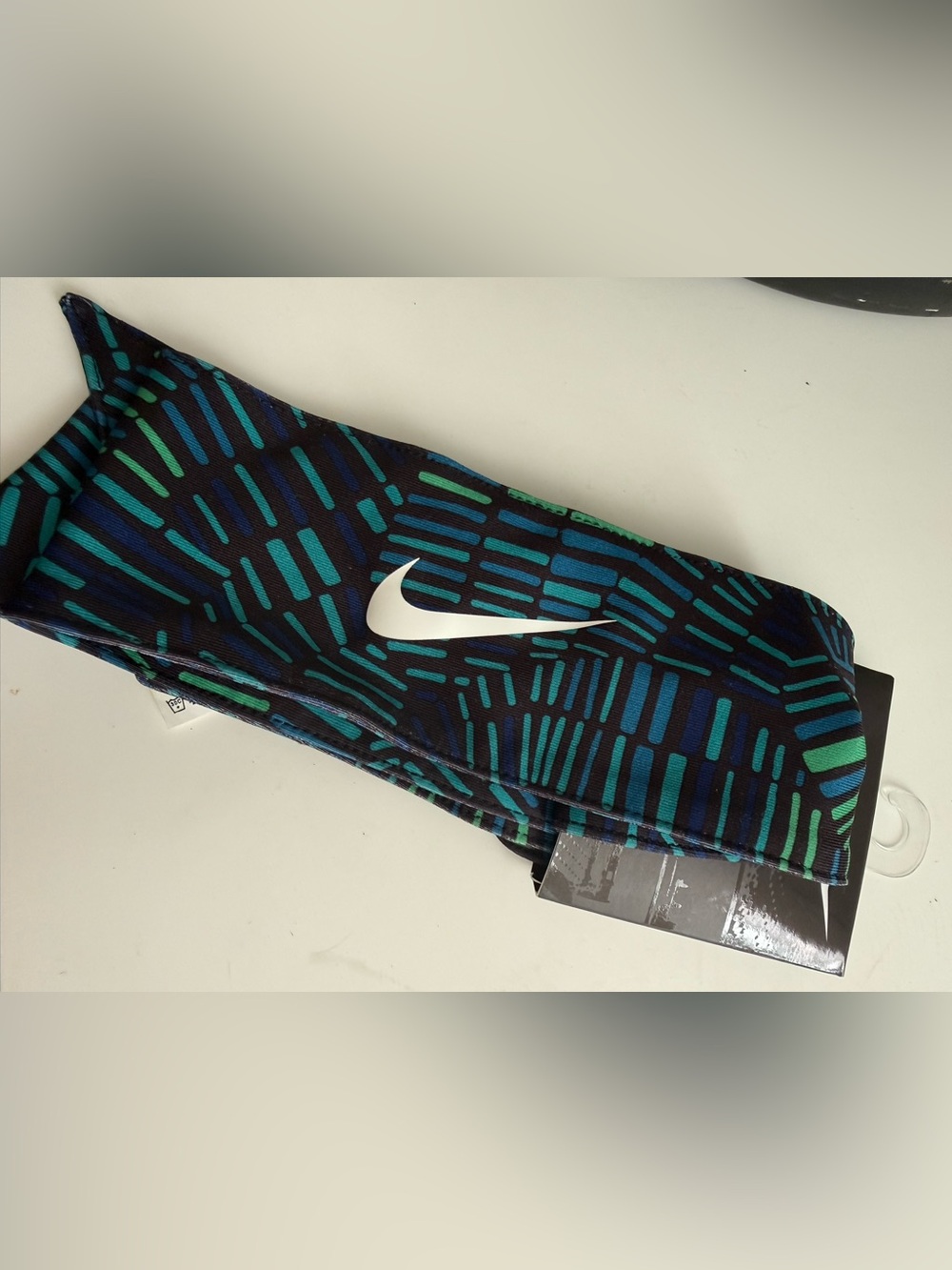 Nike Black Headband with Teal and Blue Pattern and White Swoosh